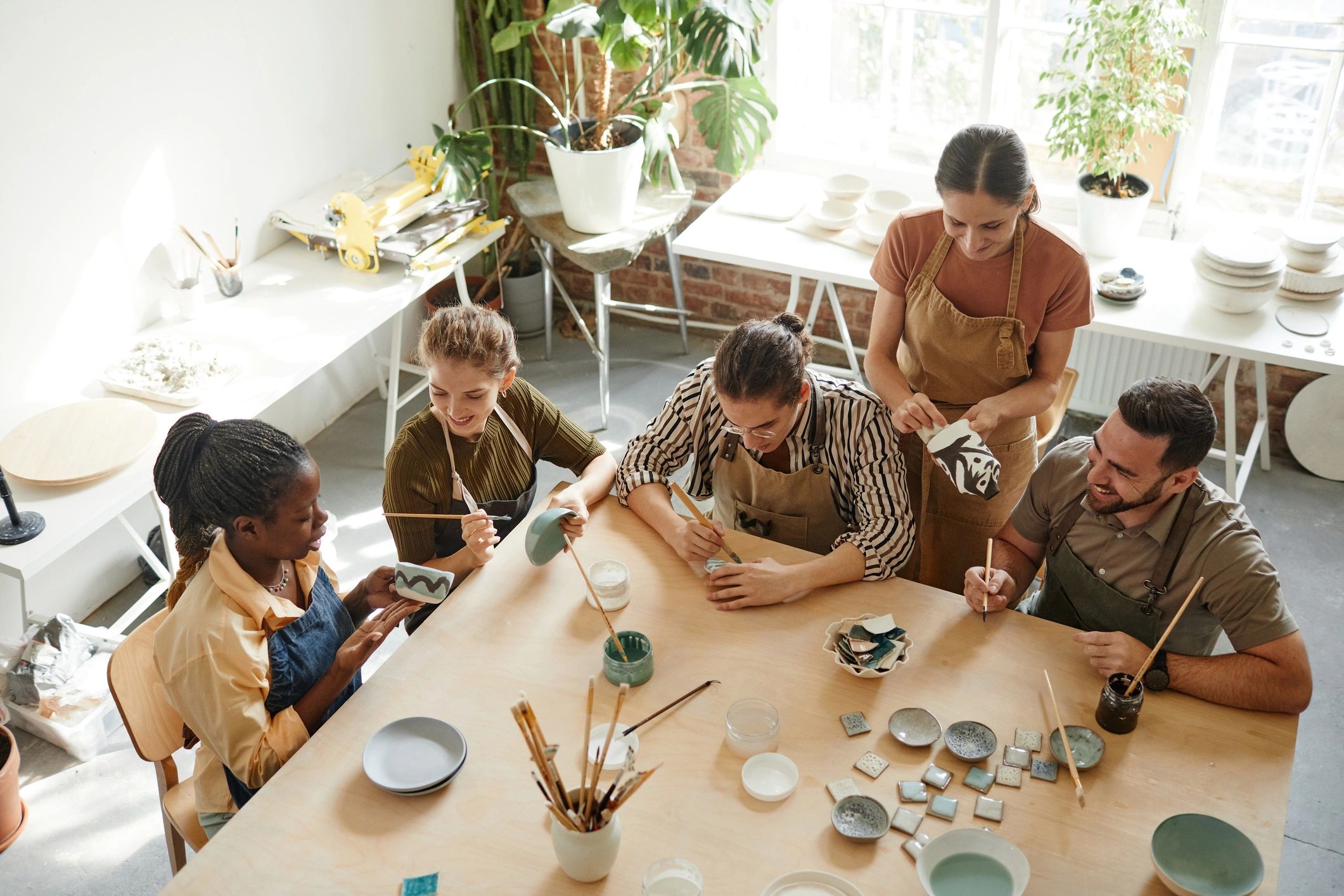 People developing practical skills together in a hands-on workshop