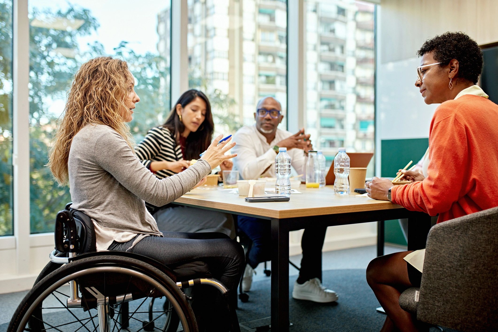 People collaborating and planning together in a supportive community setting